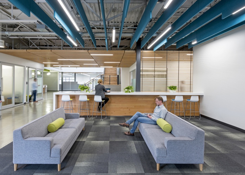 Modern commercial office buildout with lounge and workspace areas