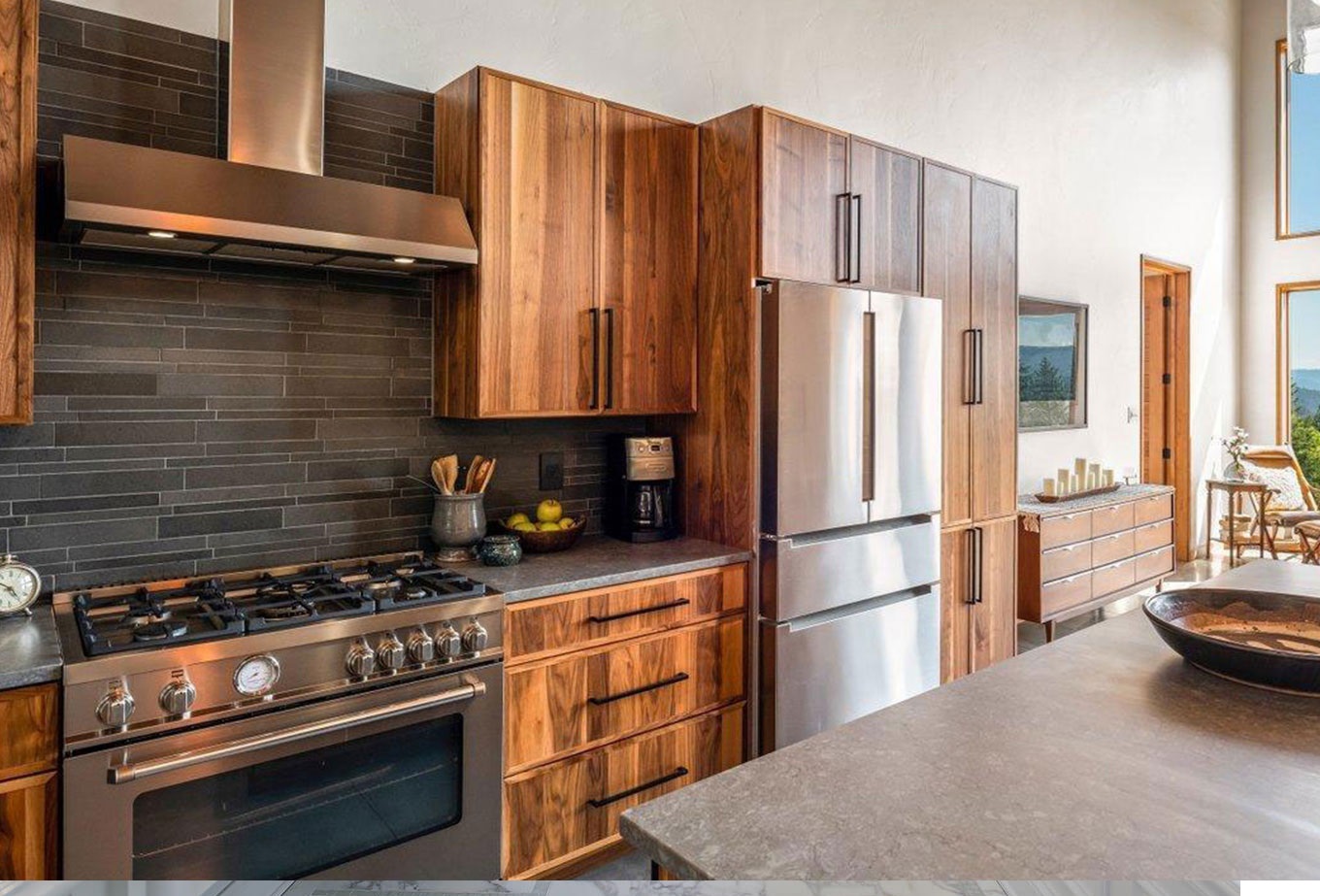 High-end kitchen remodel with custom wood cabinetry and professional appliances