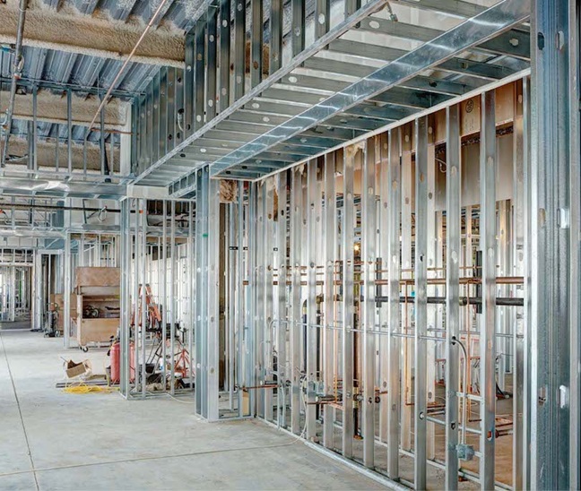 Steel stud framing during a garage addition build